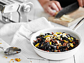 Black pasta with sun-dried vegetables