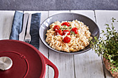 Oven-baked risotto with cherry tomatoes