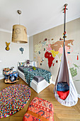 Hanging chair and wall stickers in child's bedroom
