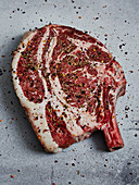 Seasoned beef steak with bone in