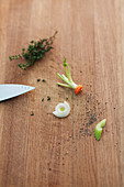 Remains of vegetables with a knife and thyme