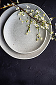 Spring table setting with peach blossom branch