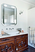 Antique vanity and wall mirror in the bathroom
