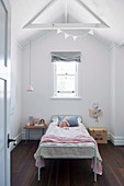 Simple girl's room under the open roof