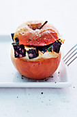 A baked apple filled with Himmel and Erde (black pudding, fried onions, and mashed potato with apple sauce)