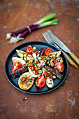Grilled baby aubergines with tomatoes, roasted buckwheat and a chimichurri dressing