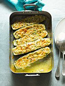 Stuffed, gratinated courgettes