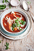 Tomato soup with homemade noodles and lovage
