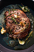 Seared beef steak with garlic, spices and rosemary