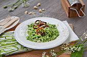 Wild garlic spaetzle with parmesan and onion rings
