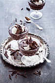 Chocolate pudding with whipped cream and chocolate shavings