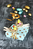 Gift box decorated with handmade Easter nests
