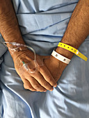 Hospital Patient with IV, ID Bracelet with QR code