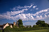 Altocumulus castellanus clouds over a rural scene