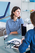 Doctor discussing with a female patient