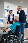 Patients at a hospital reception desk