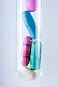 Pills and capsules in test tube