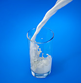 Pouring milk into a glass with splash, illustration