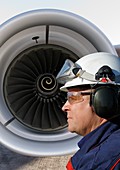 Engineer with large jet engine