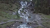 Hiker by Siebenbrunnen falls, Switzerland