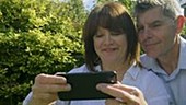 Couple photographing themselves on phone
