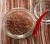 Homemade salt mixture with chilli and chocolate in a preserving jar