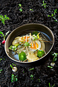 Natural cuisine: hops shoots with soft-boiled eggs and beer foam sauce