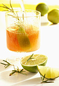 Homemade rosemary syrup with limes and cane sugar
