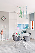 Modern kitchen-dining room with dining set and pastel accents
