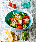 Italian bowl with broccoli, tomato sauce, hummus and crostini
