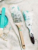 Paintbrushes and turquoise blue color
