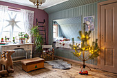 Cubby bed and vintage desk in festively decorated child's bedroom