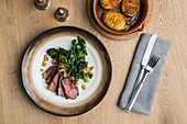 Beef steak with broccolini and hasselback potatoes