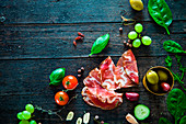 Italian ham, prosciutto and salami, ingredients for bruschetta, crostini or sandwich bar