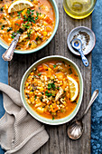 Two bowls of chicken and vegetable soup
