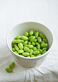 Edamame beans on bowl on a table