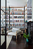 Library room with floor-to-ceiling bookshelves and shelf ladder