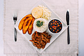 Pabellon Criollo, White Rice, Black beans, Fried plantains, and Shredded beef (Traditional Venezuelan dish)