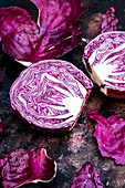 A raw round red cabbage, cut across the middle