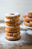 Stacked donuts with powdered sugar