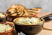 Artichoke and spinach dip served with toasted bread