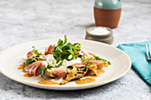 Grilled artichokes with ham and rocket