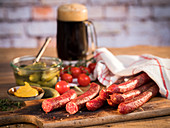 Beef pork sausages, mustard, gherkins, cherry tomatoes and dark country beer