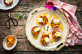 Grilled peaches with honey, sour cream and thyme