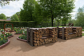 Firewood stacked to form seats with added seat boards