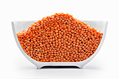 Orange lentils in a cross-cut bowl