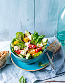 Avocado and tomato salad with basil and grilled flatbread