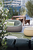Various seating and potted plants in outdoor lounge area