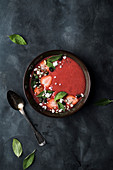 Strawberry and rhubarb cream soup, spiced with ginger and cardamon, topped with frrsh mint leaves, strawberries, feta cheese, pumpkin seeds, chia seeds and sunflower seeds