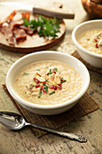 Caulifower puree soup in white bowl